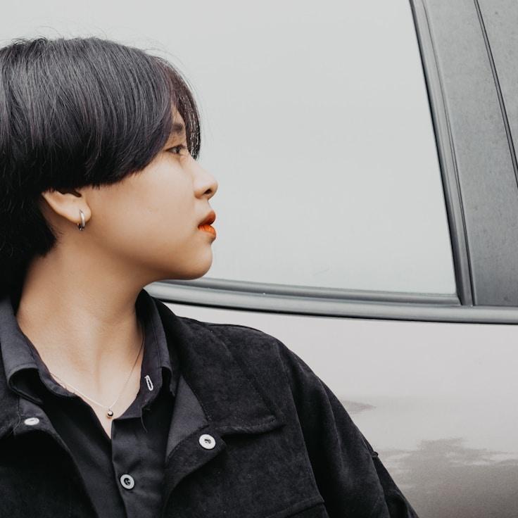 Amara Shah, Lead Design Curator at SmoothVectorCompass, reviewing corporate floral arrangements